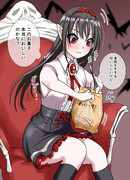 お菓子を開ける吸血鬼