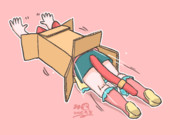 段ボールにピットインする猫