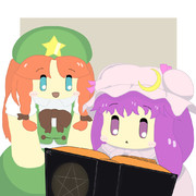 本を読むパチュリーと覗き込む美鈴